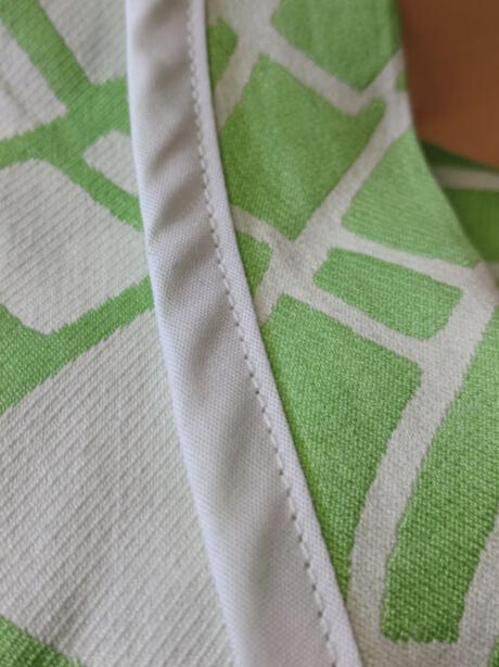 white binding on inside jacket hem